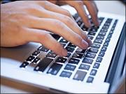 Fingers typing on keyboard